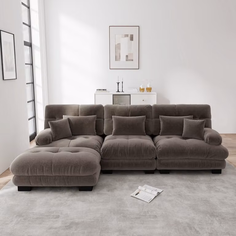 Luxe modulaire L-vormige hoekbank met slaapfunctie, hocker en sierkussens in bruin
